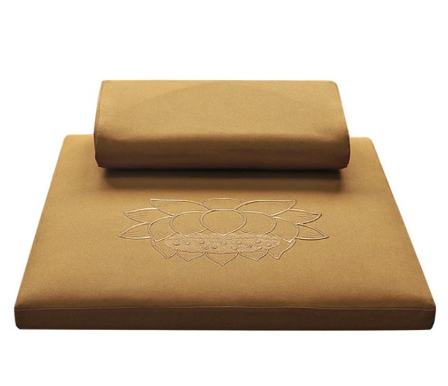 A gold zafu and zabuton meditation set with lotus designed embroidery