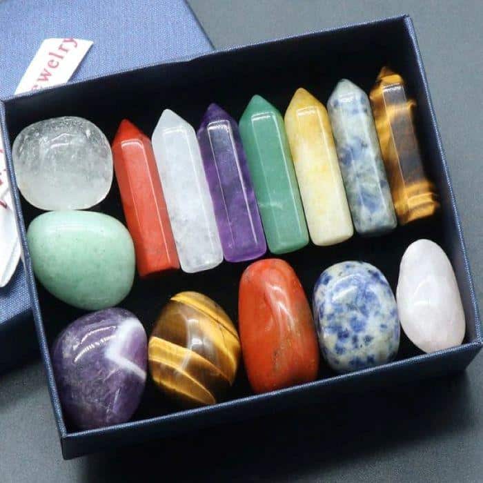 A convenient box full of organized tumbled meditation stones 