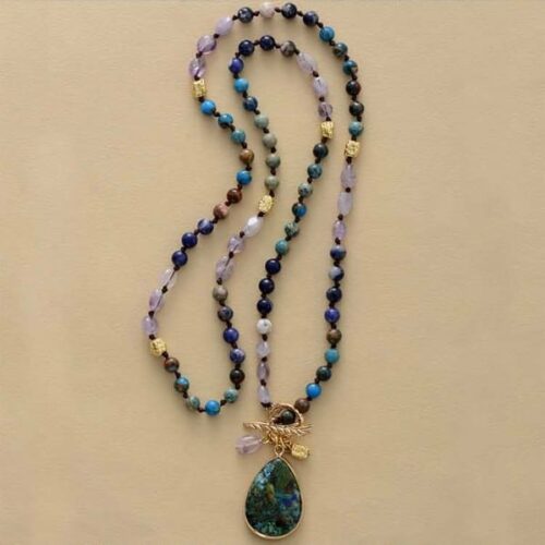 a full image of Natural Stone Beads Meditation Necklace laying flat on a smooth surface