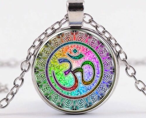 a close-up image of AUM OM Symbol Meditation Necklace on a white surface