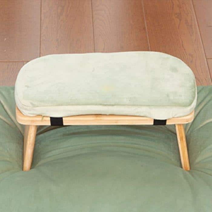 A foldable wooden meditation bench with yellow-green detachable cushion