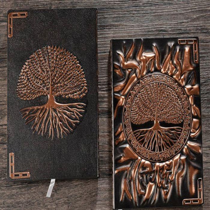 A black meditation journal with brown Tree of Life design