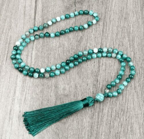 an image of 108 Bead Green Stripe Onyx Stone Prayer Meditation Necklace  laying in a flat wood