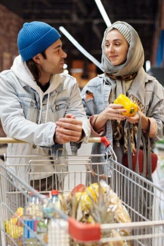 Couple Buying Groceries at a Supermarket - everyday life